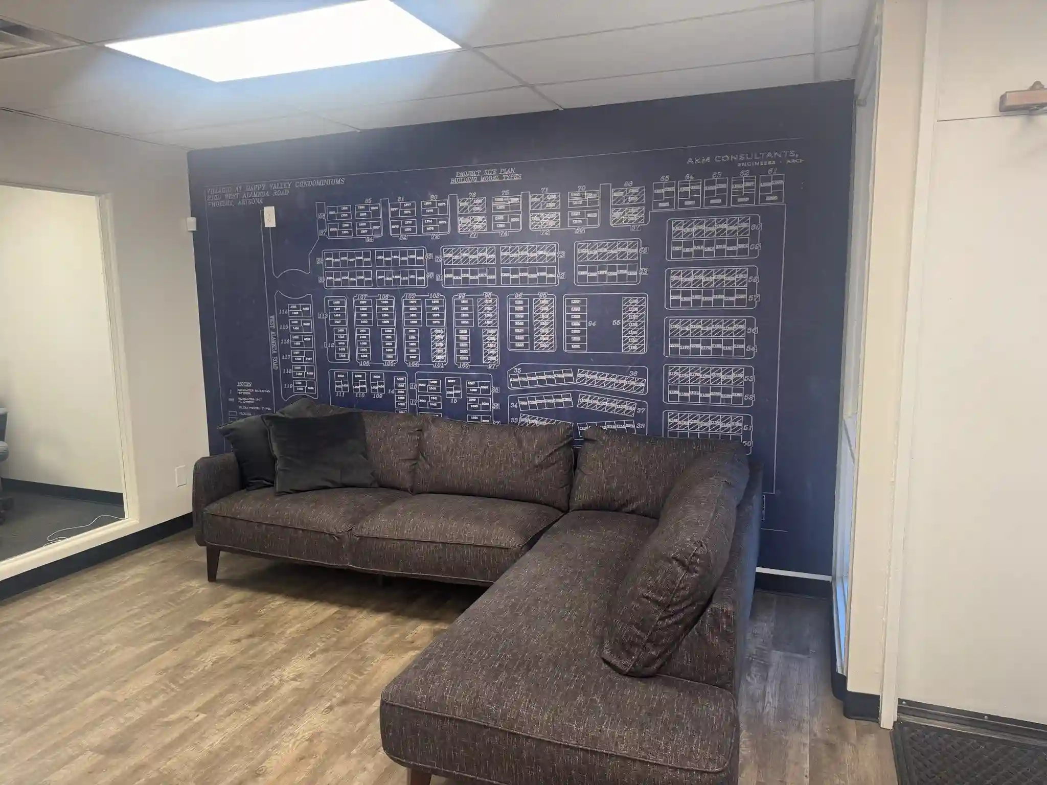 Professional wallpaper installation in a bright living room by Dan Warren WallCoverings in Washington