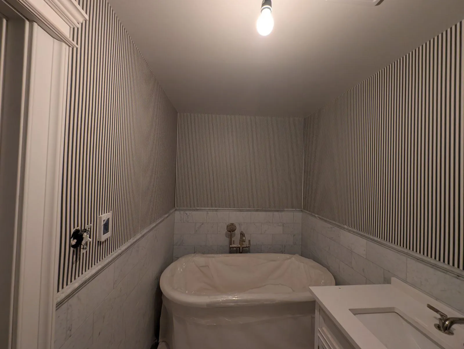 Professional wallpaper removal and wall preparation process